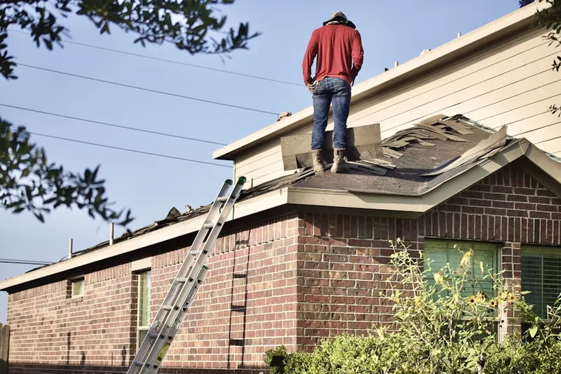 Professional roofer working on a residential roof in Emmaus